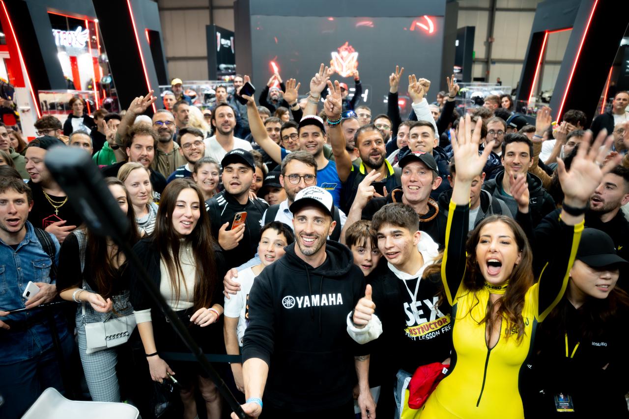 Crowd cheering at Insta360 booth, EICMA 2024.